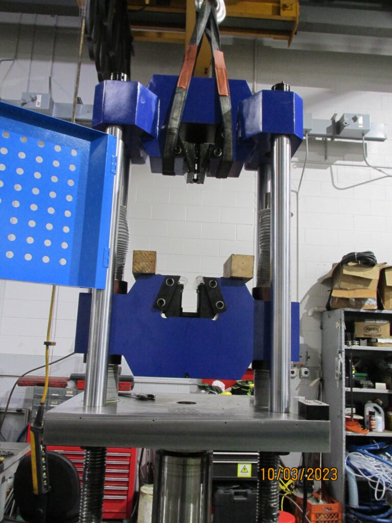 Use crane or forklift to lift up table, crossheads and cylinder